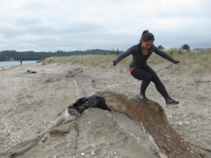 Sandy pistol squatting at the beach