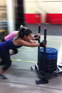 Cath and Sandy pushing a 120kg sled